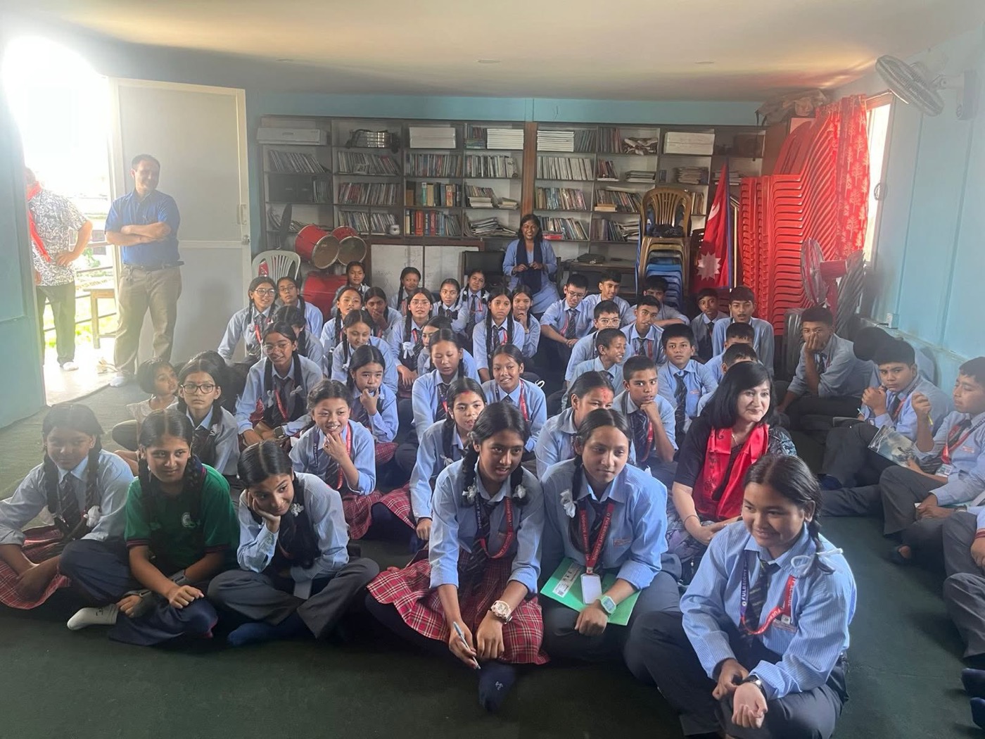 Alisha leading a digital-awareness workshop with a full classroom of students in Bhaktapur